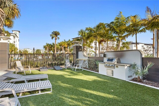 view of yard featuring exterior kitchen and fence