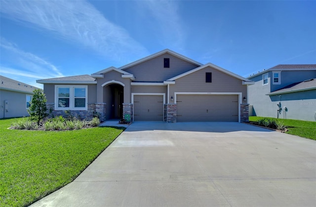 craftsman inspired home with driveway, stone siding, a garage, and a front yard