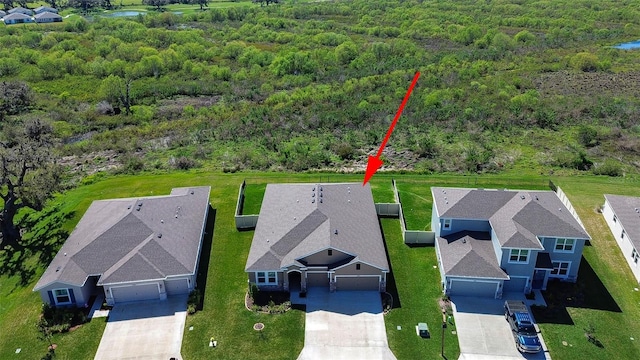 aerial view featuring a wooded view