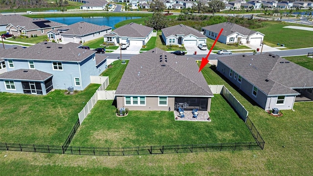 bird's eye view with a water view and a residential view