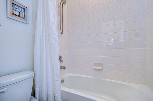 full bath with shower / tub combo and toilet