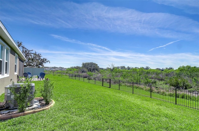 view of yard featuring a fenced backyard and a rural view