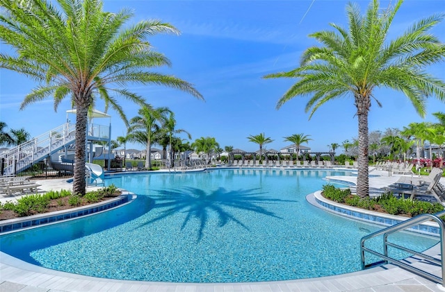 view of swimming pool featuring a water slide