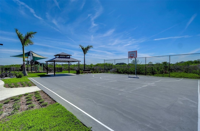 view of sport court featuring a gazebo, playground community, fence, and community basketball court