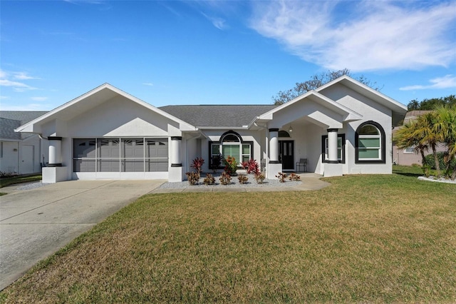 single story home featuring a garage, stucco siding, driveway, and a front yard