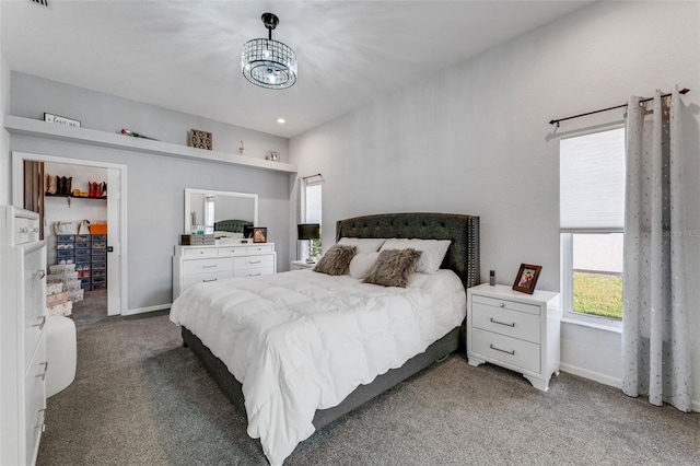 14247 Spanish Wells Dr, Hudson, FL 34667 - bedroom featuring a chandelier, carpet, visible vents, and baseboards