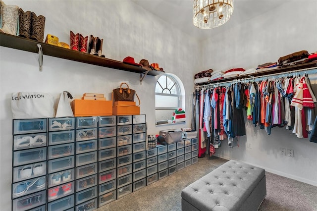 14247 Spanish Wells Dr, Hudson, FL 34667 - walk in closet with carpet and a notable chandelier