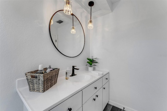 14247 Spanish Wells Dr, Hudson, FL 34667 - bathroom featuring baseboards, visible vents, and vanity