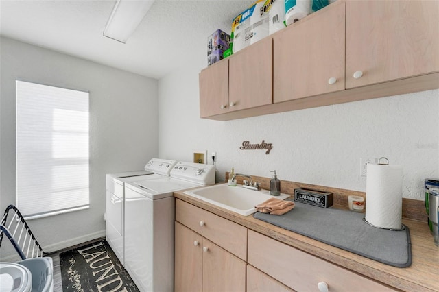 14247 Spanish Wells Dr, Hudson, FL 34667 - washroom featuring washer and dryer, cabinet space, a sink, and baseboards