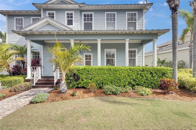 view of front of property with a front lawn and a porch