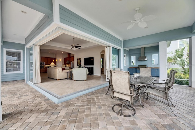 view of patio with a ceiling fan and outdoor dining space