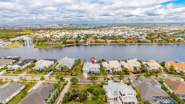 bird's eye view with a water view and a residential view