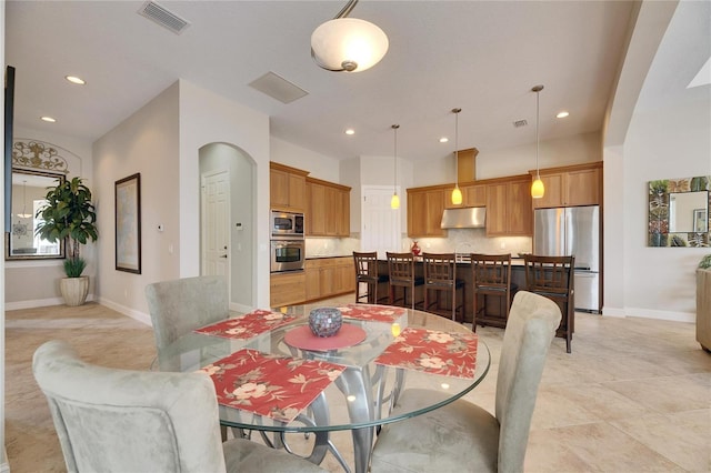 dining area featuring baseboards, visible vents, and recessed lighting