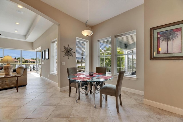 dining area featuring recessed lighting, baseboards, and light tile patterned floors