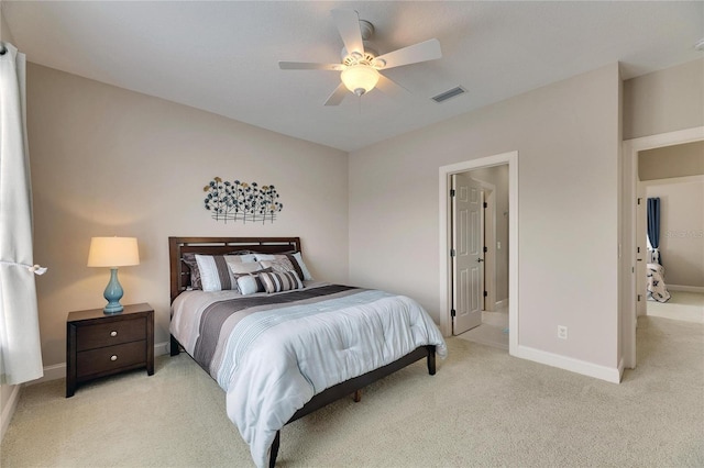 bedroom with light carpet, a ceiling fan, visible vents, and baseboards