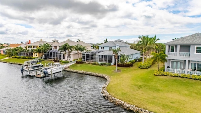 bird's eye view featuring a water view and a residential view