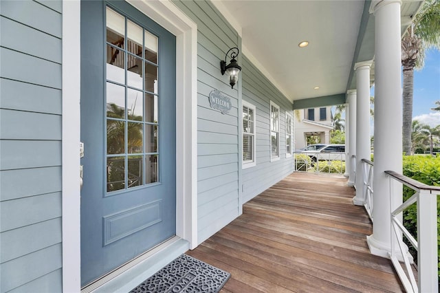 wooden terrace with a porch