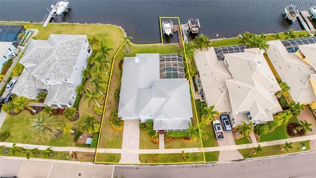 birds eye view of property featuring a residential view and a water view