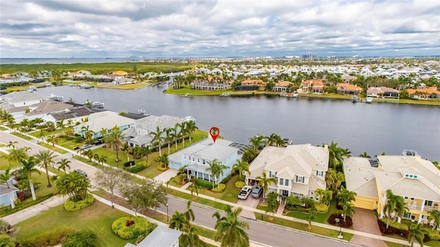 bird's eye view with a water view and a residential view