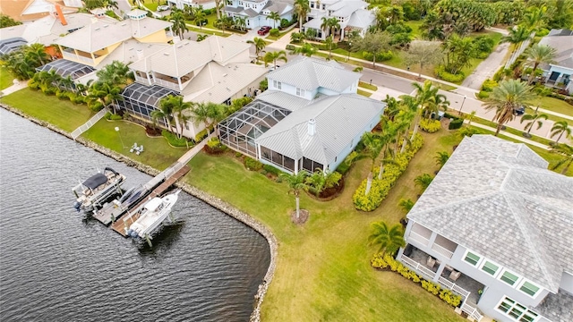 bird's eye view featuring a water view and a residential view