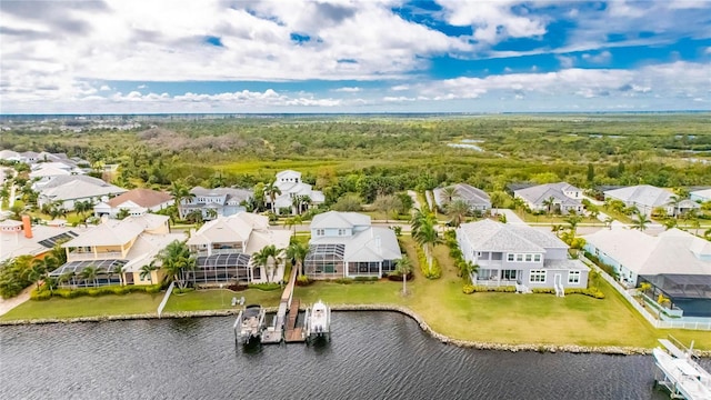 drone / aerial view featuring a residential view and a water view