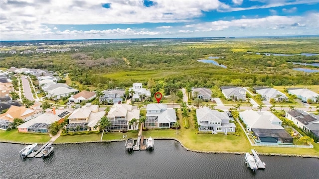 birds eye view of property featuring a water view and a residential view