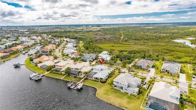 bird's eye view featuring a water view and a residential view