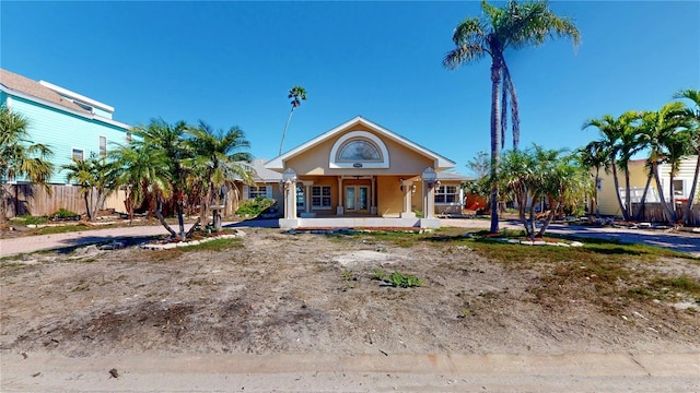 view of front of home featuring fence