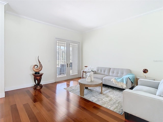 living area featuring wood finished floors, baseboards, french doors, and ornamental molding