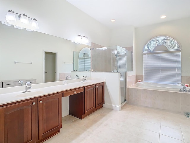 full bath with a shower stall, a bath, double vanity, and a sink