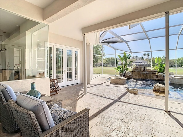 view of patio featuring french doors, a swimming pool, and a lanai