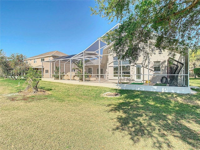 view of yard with a lanai, a patio area, and a residential view