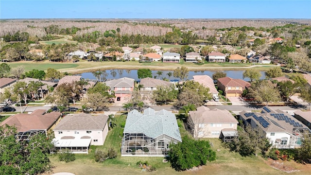 bird's eye view with a residential view and a water view