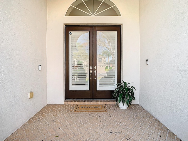 18111 Diamond Cove Ct, Tampa, FL 33647 - property entrance with french doors and stucco siding