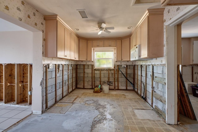 interior space featuring a ceiling fan and visible vents