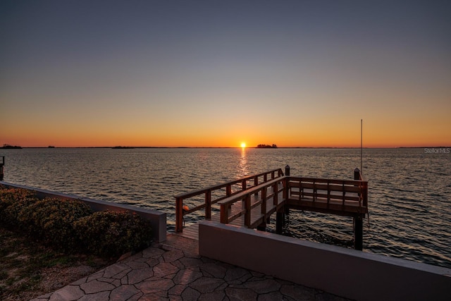 dock area with a water view