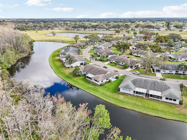 drone / aerial view featuring a residential view and a water view