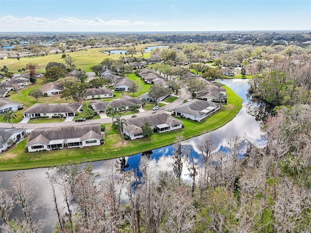 birds eye view of property featuring a water view and a residential view