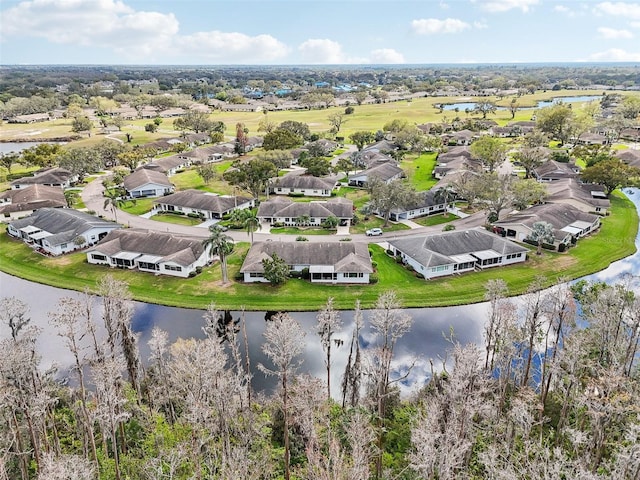 drone / aerial view with a residential view and a water view