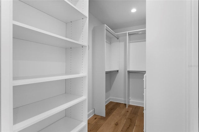 spacious closet with light wood-style floors