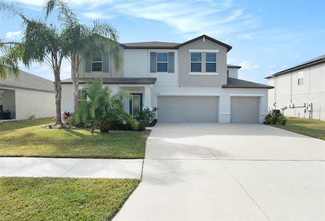 view of front of property with an attached garage, driveway, a front lawn, and stucco siding