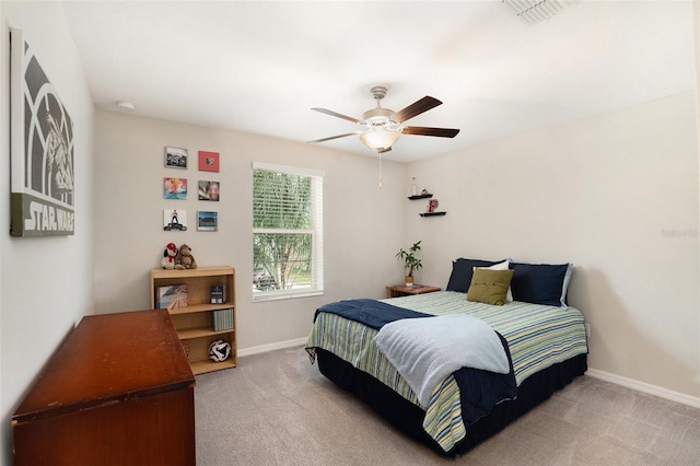 bedroom with carpet floors, visible vents, baseboards, and a ceiling fan