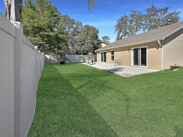 view of yard with a fenced backyard and a patio