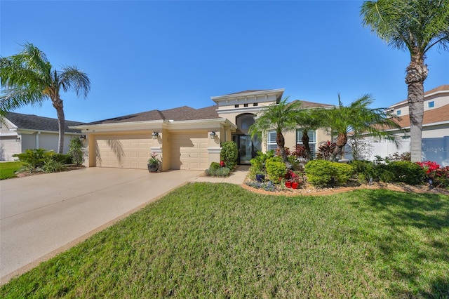 view of front of home featuring an attached garage, stucco siding, concrete driveway, and a front yard