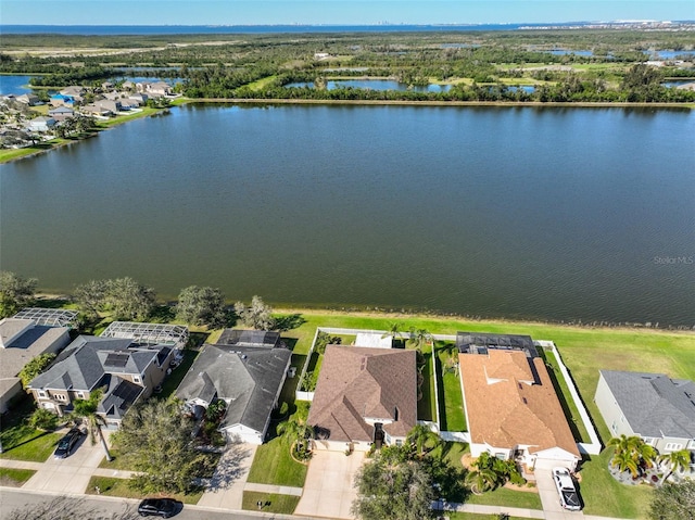 birds eye view of property featuring a residential view and a water view