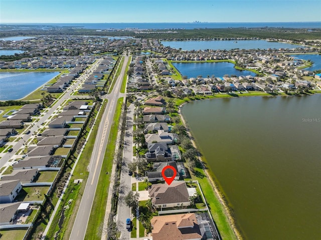 bird's eye view with a water view and a residential view