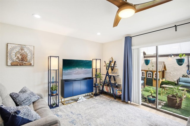 living area featuring a ceiling fan and recessed lighting