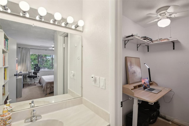 bathroom featuring a ceiling fan and vanity