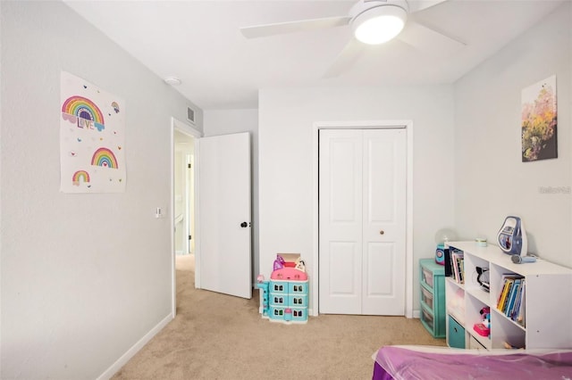 game room with baseboards, visible vents, a ceiling fan, and light colored carpet