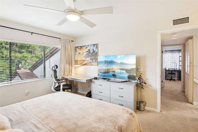 bedroom with baseboards, ceiling fan, visible vents, and light colored carpet